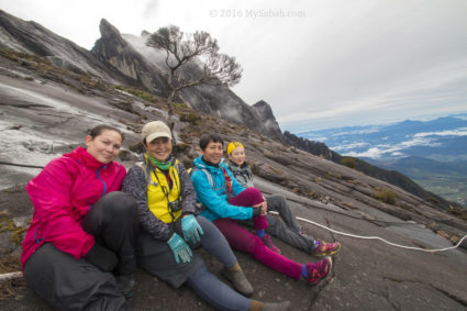 girls rest on slope