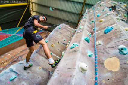 descending from rock wall