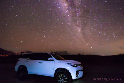 starry sky behind 4 wheel drive