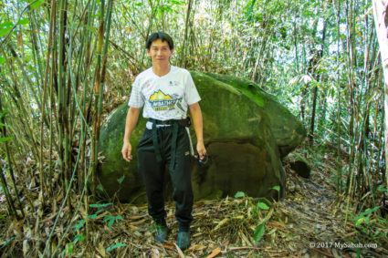 Azlan, the one who opens the trail to the huge boat rock