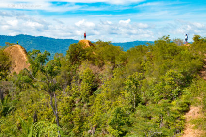 Climbers stood on three high points of Bukit Lugas