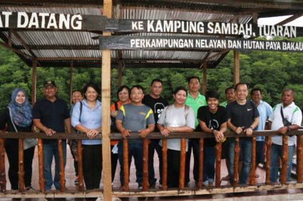 Group photo at jetty of Kampung Sambah village