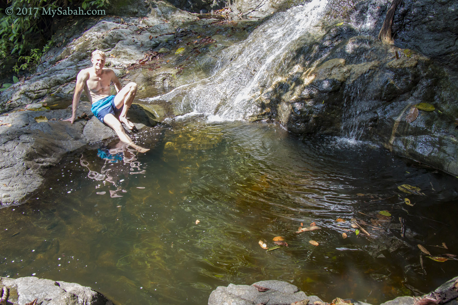 Swimming in the waterfall pond