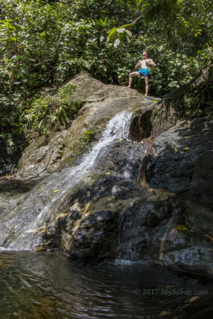 tourist playing Tarzan