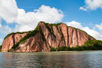 Red cliff face of Berhala Island