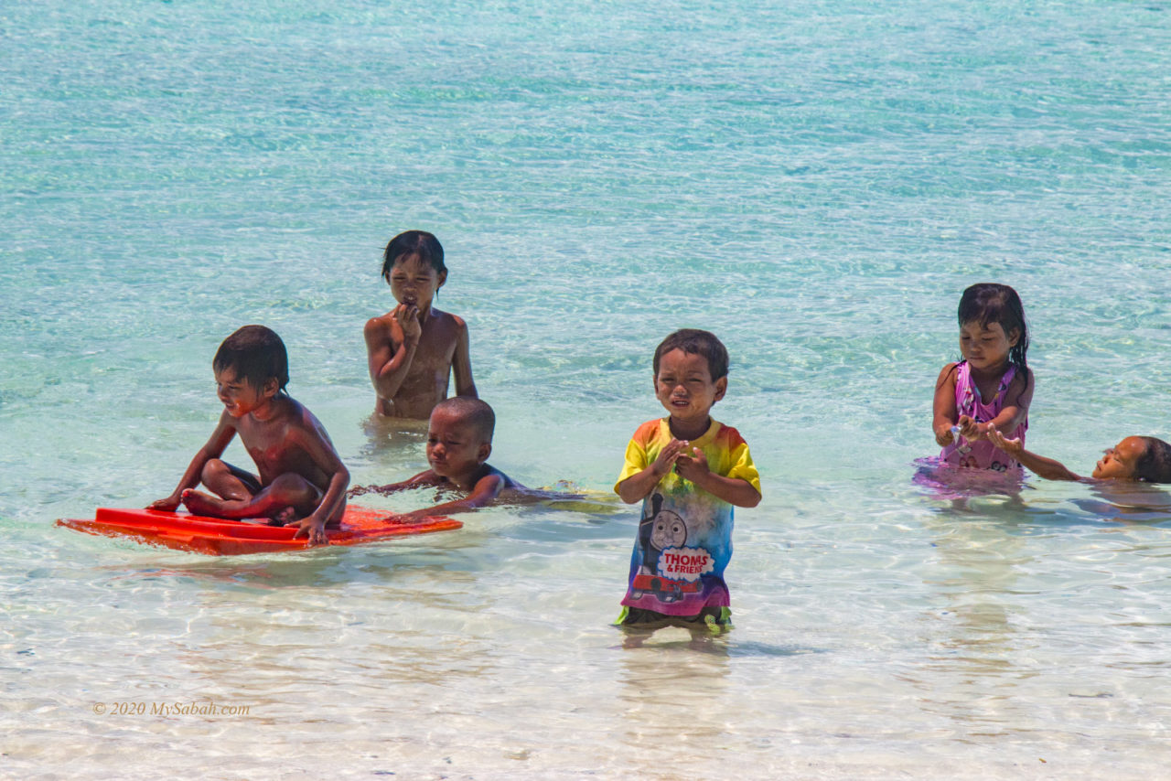 Sea Bajau children playing in the sea
