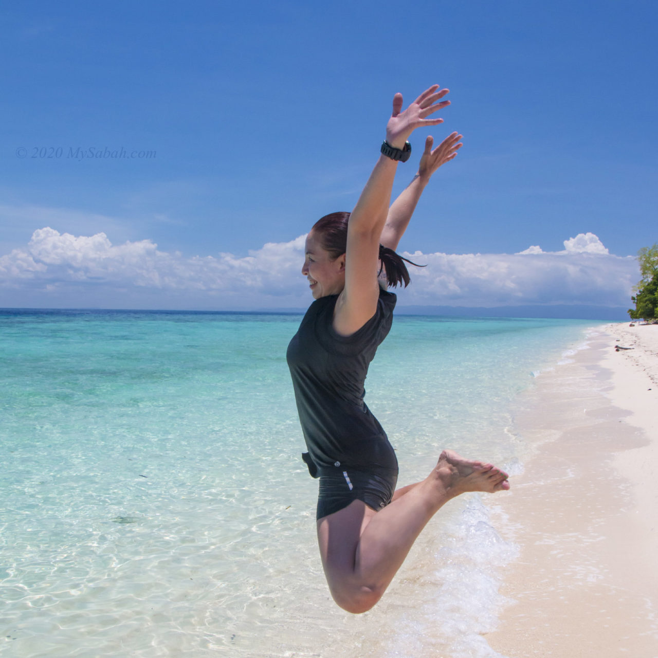 Jumping on the beach of Sibuan Island