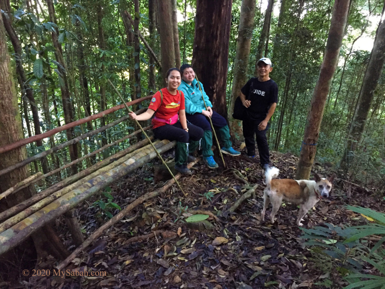 Climbers taking a rest on a bench