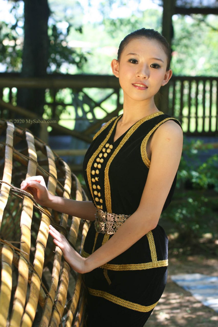 Kadazan Penampang girl with traditional costume and tingot belts