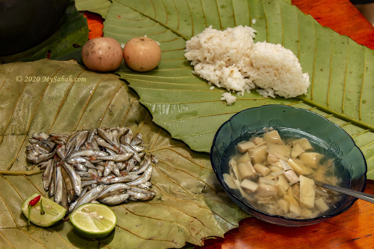 Linuput rempis (fishes wrapped in multiple layers of leaves and cooked), tree heart soup and rice
