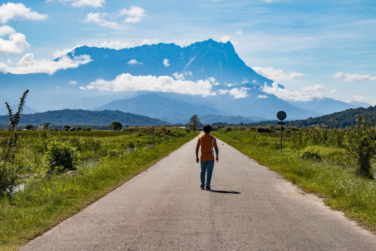 walking on the road to Mt. Kinabalu