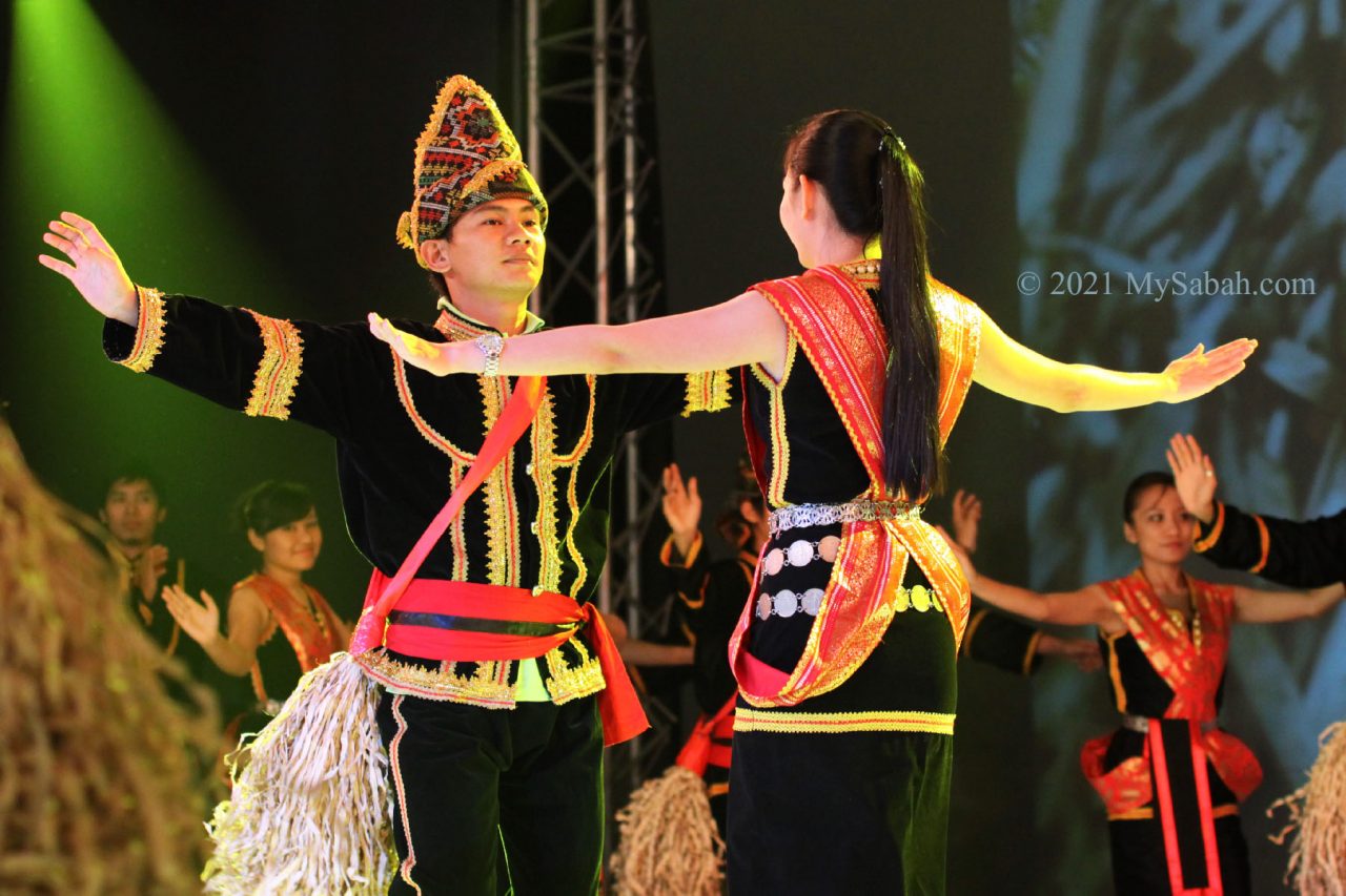 Kadazan male and female couple dancing Sumazau