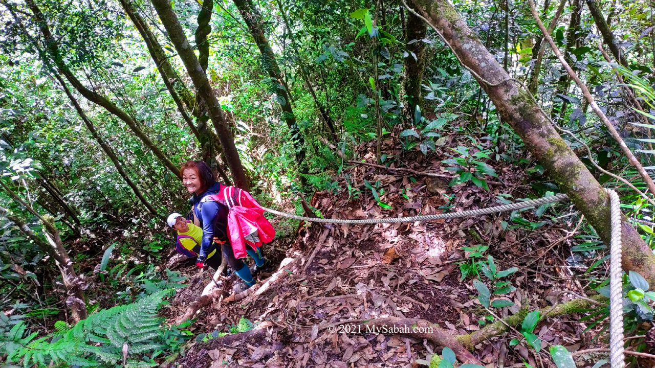 Two climbers on the descending route of loop trail of Maragang Hill