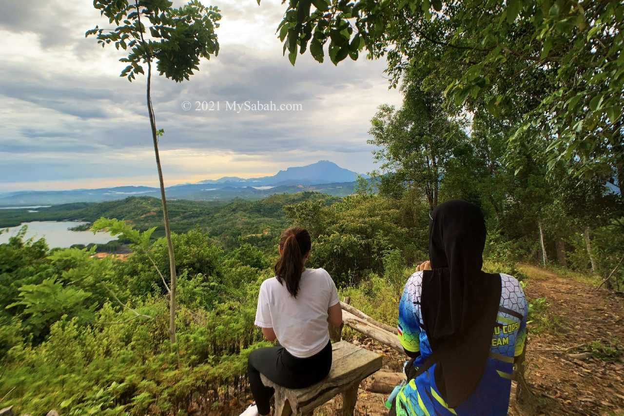 Hikers enjoy the sunrise view of Mount Kinabalu