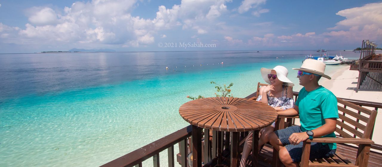 Couples enjoy the sea view of Mataking Island (Pulau Mataking)