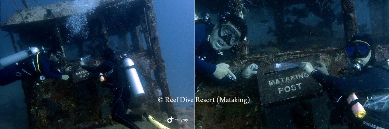 Sending postcard from the underwater post box of Mataking Island