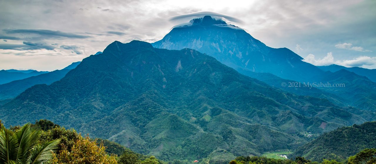 Small lenticular cloud on Mount Kinabalu. The smaller mountain is Mount Nungkok (a.k.a. Anak Kinabalu)