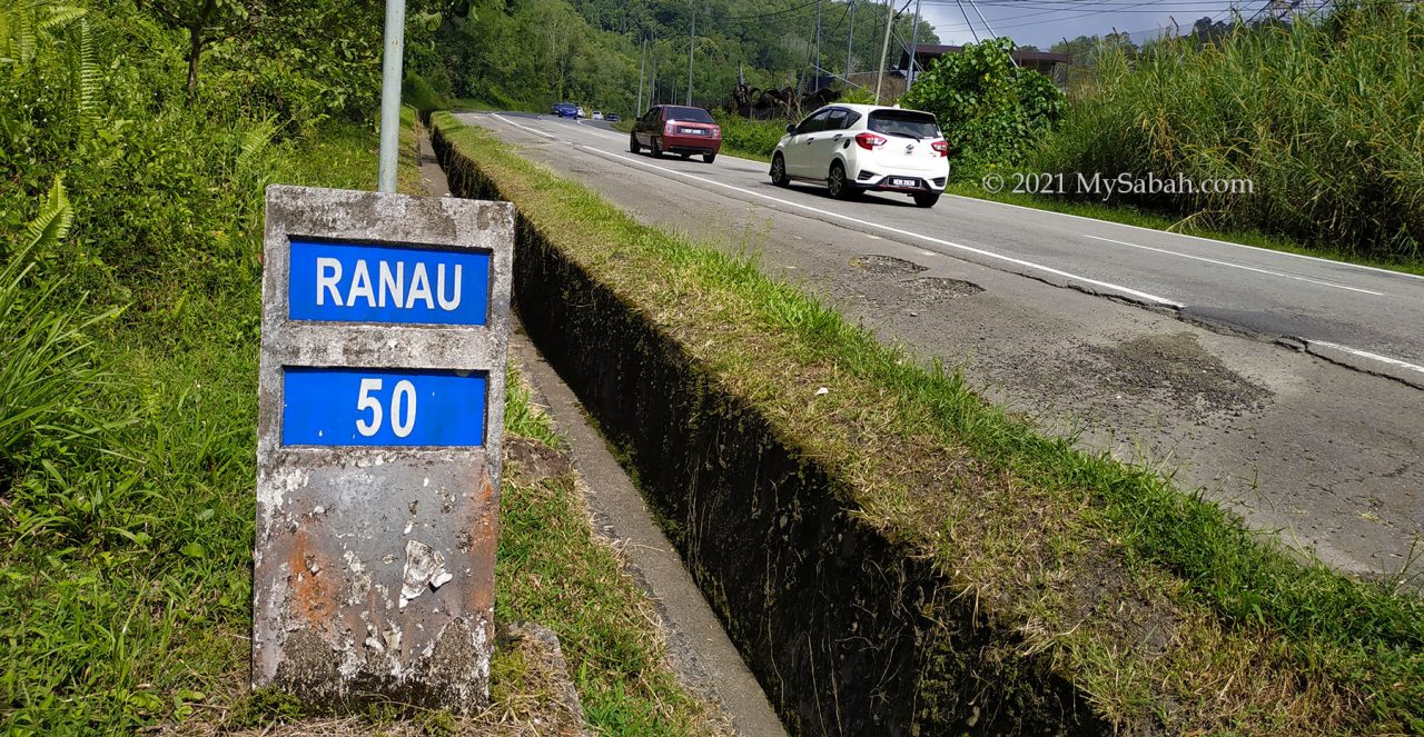 Milestone next to road in Sabah