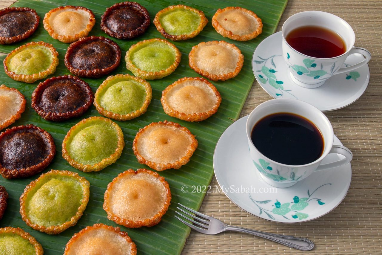 Lines of Kuih Pinjaram (Penyaram) on banana leaf