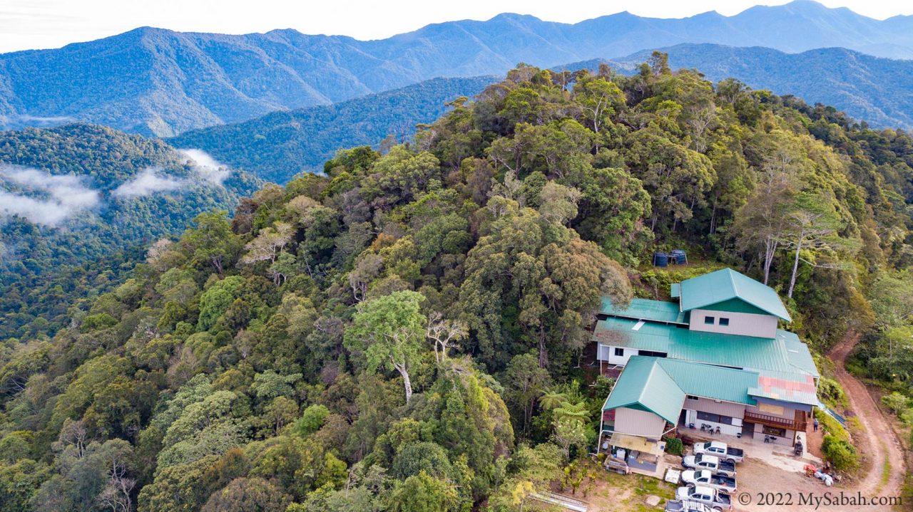 Borneo Jungle Girl Camp surrounded by mountain range and rainforest