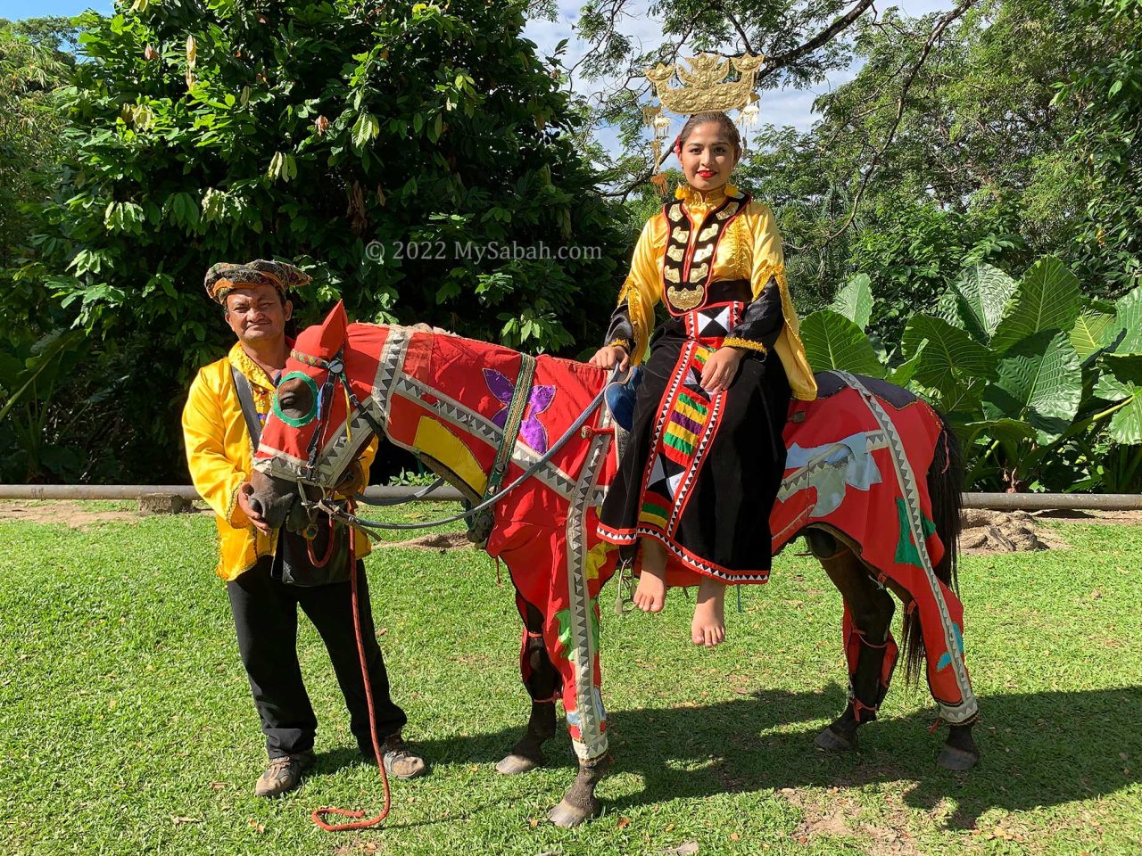 Bajau Sama girl on a horse decorated in Bajau fashion