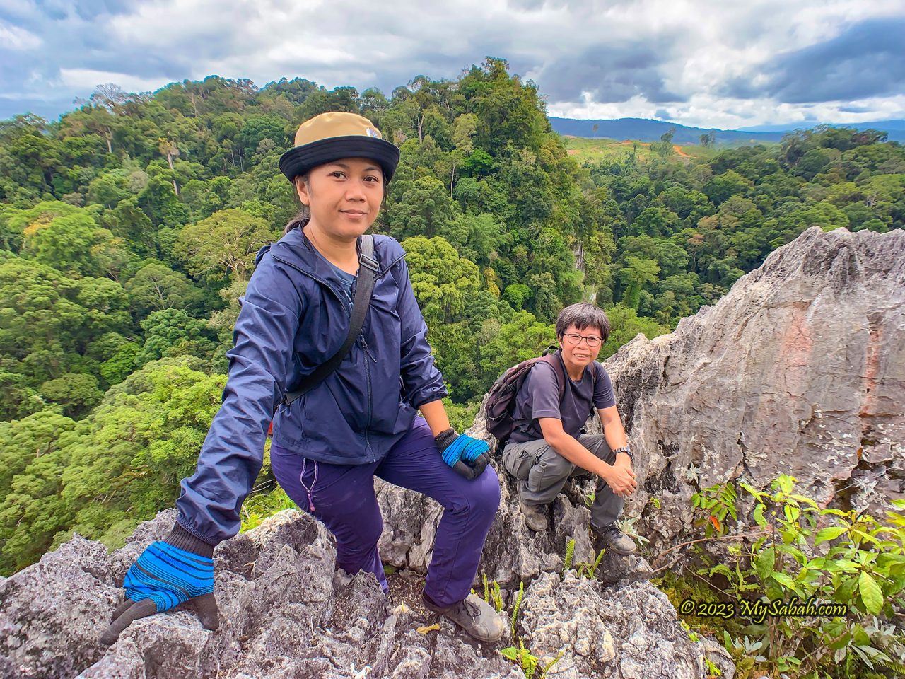 Top view of Batu Punggul. The high point far behind is Batu Tinagas (another petrified longhouse in the legend) covered by dense forest.