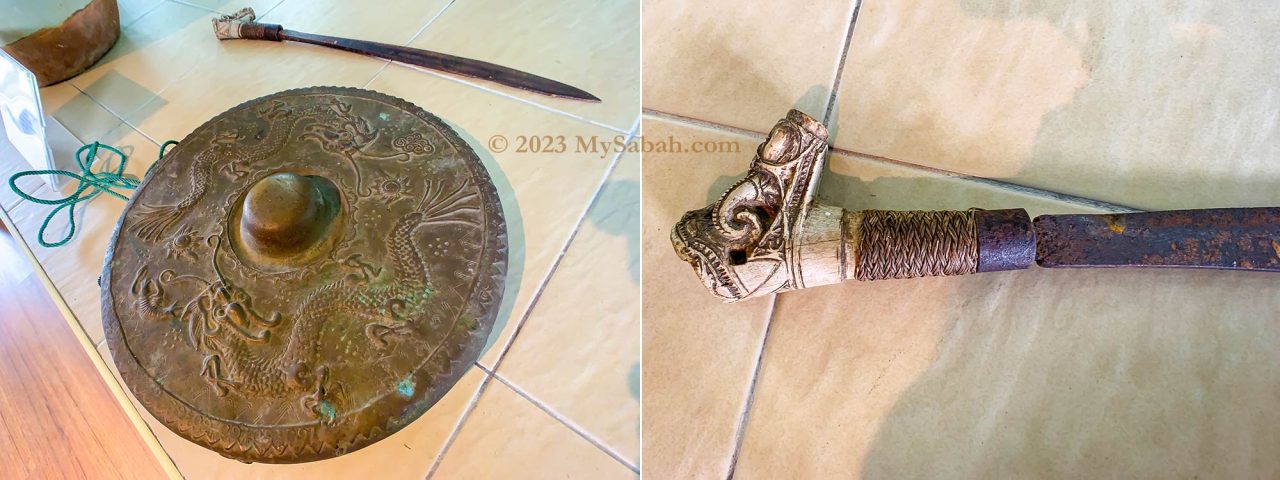 Left: sword and gong. Right: real headhunting sword with Dayak decoration