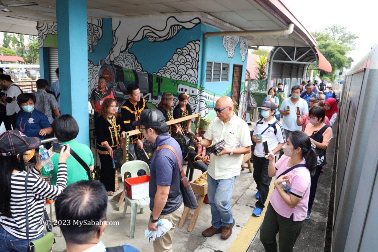 Papar cultural troupe welcomes the passengers of North Borneo train tour with traditional music