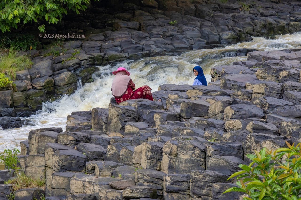 Tourists taking pictures at Batu Bersusun of Tawau