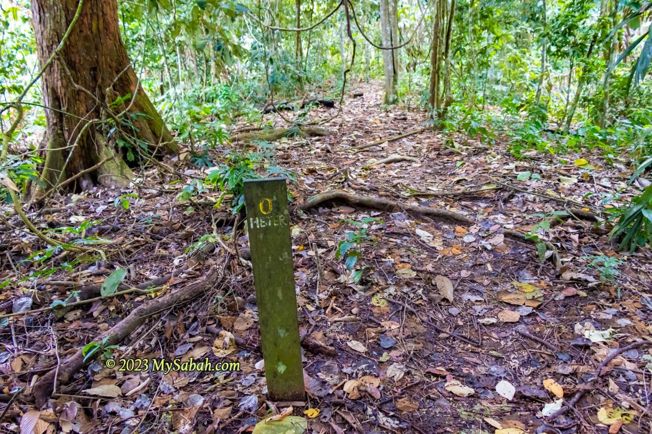 0 Meter signage on the peak to mark the end of the climb