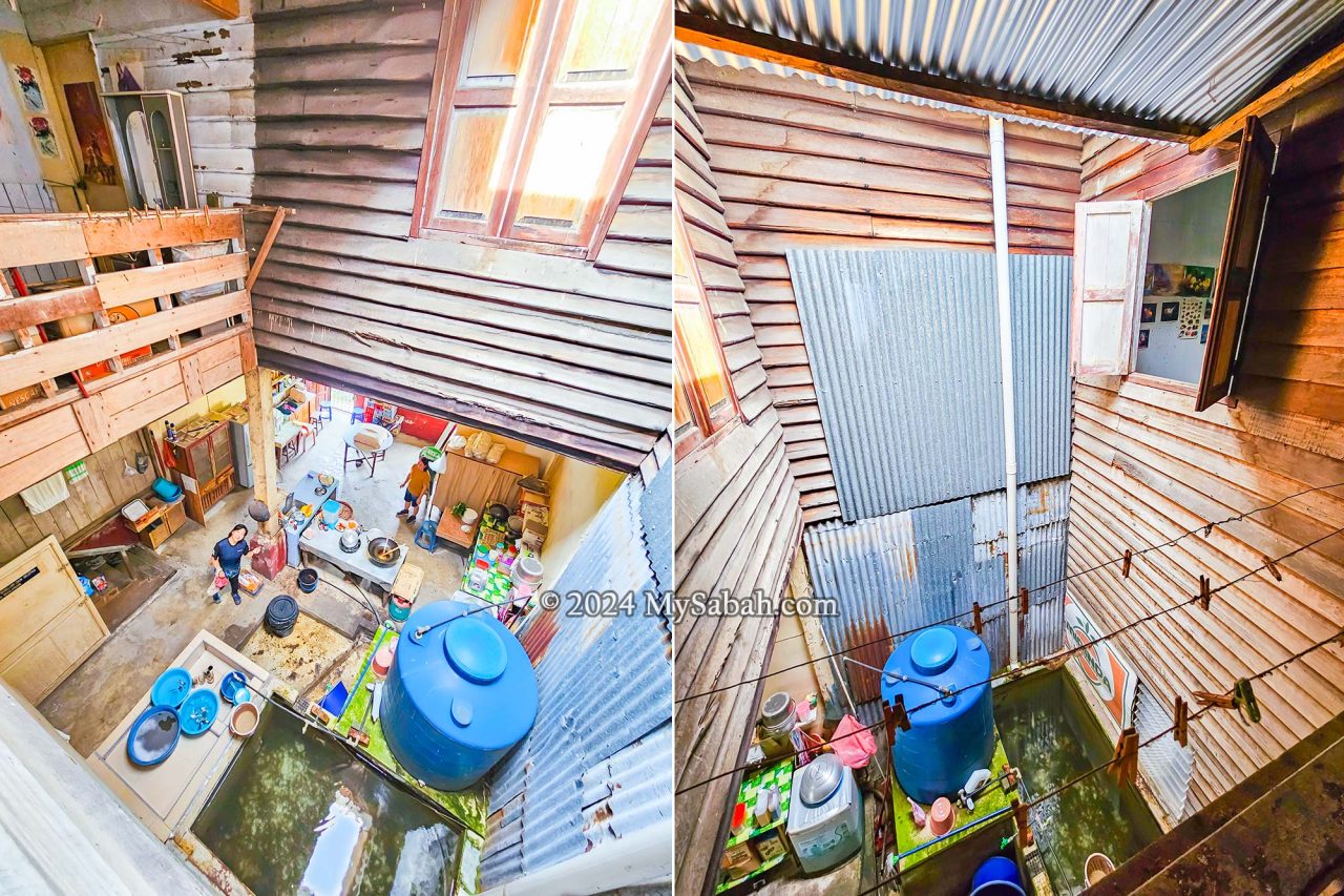 View into the internal airwell, showing the walk way to the open kitchen area, water storage tank, washing and drying areas.