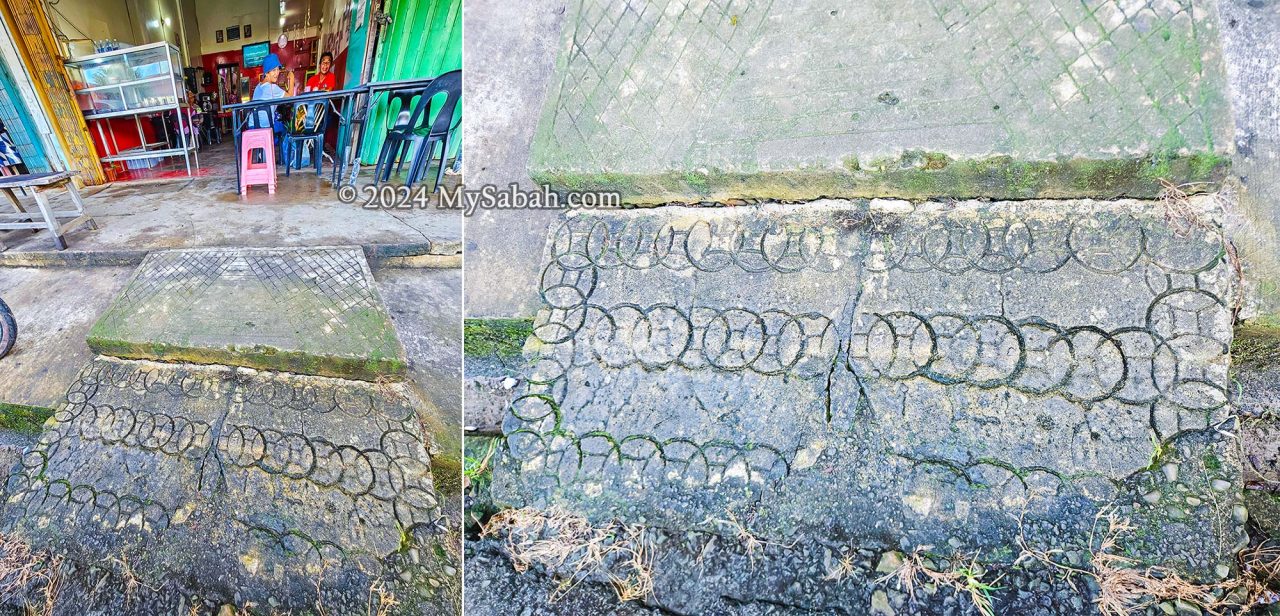 Concrete pavement slab in front of one of the Membakut's post-war shophouse decorated with etchings of Chinese coins