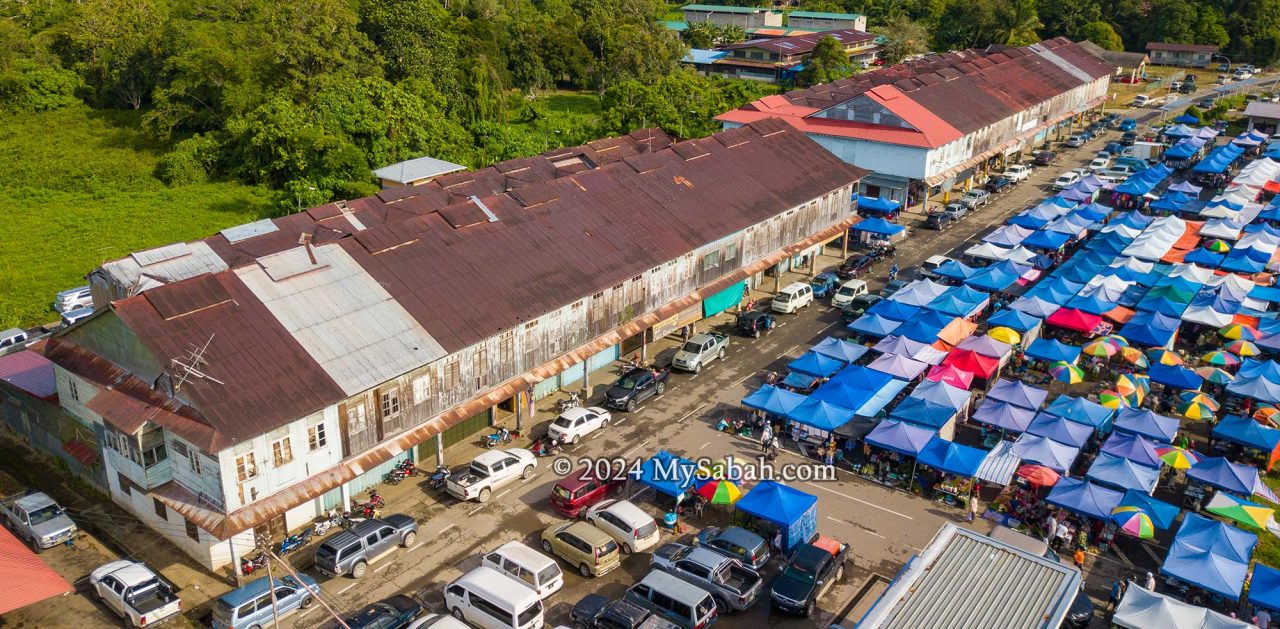 Two Pre-WWII shophouses and weekly tamu market at Membakut old township