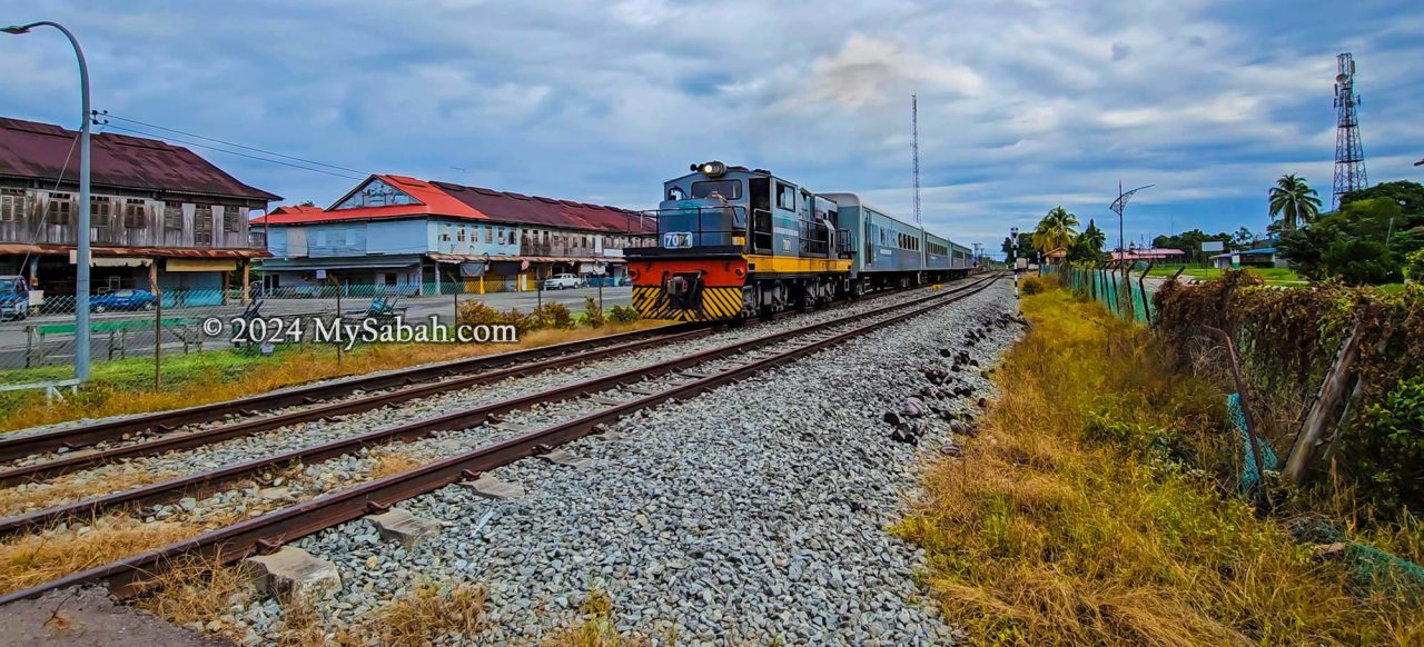 A train passing by Membakut town